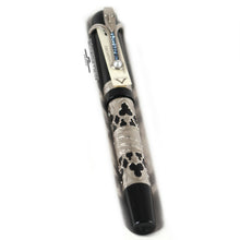 Load image into Gallery viewer, Angled front view of the fountain pen. It has a small card under the clip with the Visconti logo and the pen's materials.