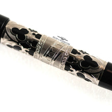 Load image into Gallery viewer, Close  up to the engraved filigree of the fountain pen's barrel.