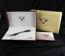 Load image into Gallery viewer, The fountain pen arranged with the presentation box, booklets, and yellow cardboard box.
