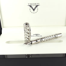 Load image into Gallery viewer, The fountain pen with the cap set to the side on top of the presentation box's slot.
