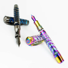 Load image into Gallery viewer, The blue and rainbow fountain pen Set arranged with their caps set underneath the barrels on a white background.
