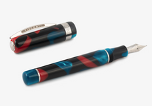 Load image into Gallery viewer, The Visconti Woodstock Dark Lava Lamp Fountain Pen laid on a white background with the cap set to the side.