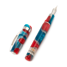 Load image into Gallery viewer, The Visconti Woodstock Lava Lamp Fountain Pen laid on a white background with the cap set to the side.