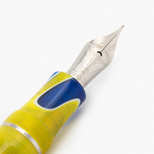 Load image into Gallery viewer, Close up to the Visconti Woodstock Peace and Love Fountain Pen nib. It is engraved with a set of decorations, 134K, M, and the word VISCONTI.