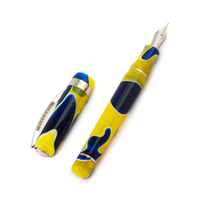 Load image into Gallery viewer, The Visconti Woodstock Peace and Love Fountain Pen laid on a white background with the cap set to the side.
