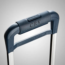Load image into Gallery viewer, Briggs & Riley Navy Suede Outsider Handle Wrap
Shown wrapped around telescoping handle of Navy Baseline suitcase.  Embossed with 'CRV' logo