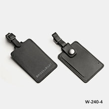 Load image into Gallery viewer, Briggs & Riley @work Leather ID Tag - Black
Image of front and back view of leather luggage tag with a sturdy metal buckle and adjustable strap