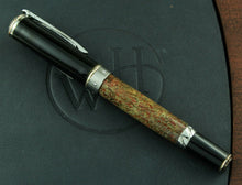 Load image into Gallery viewer, Side view of the rollerball pen on top of the presentation box. The cap and bottom of the pen are black. Front view of the rollerball with the cap, on top of the presentation box. The cap and bottom of the pen are black. The barrel is made of fossil dinosaur bone (from an Apatosaurus that walked the Earth 100 million years ago)