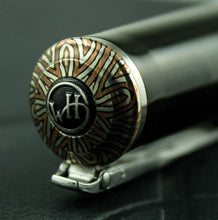 Load image into Gallery viewer, William Henry Studio Limited Close up to the top of the cap. It has a design with lines and the William Henry logo.