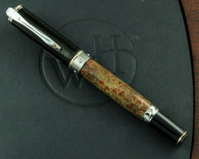 Load image into Gallery viewer, Front view of the rollerball with the cap, on top of the presentation box. The cap and bottom of the pen are black. The barrel is made of fossil dinosaur bone (from an Apatosaurus that walked the Earth 100 million years ago)