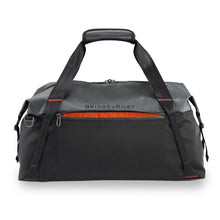 Load image into Gallery viewer, Briggs & Riley ZDX Cargo Crossbody Satchel - Black
Image of SpeedThru™ pocket for quick storage of items at security checkpoints; orange lining alerts you if the pocket is open
	Height	Width	Depth	Weight
US	13.25"	22.25"	12"	          2.1 lbs.
EU	33.8 cm	30.5 cm	56.6 cm	 .9 kg