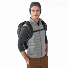 Load image into Gallery viewer, Briggs & Riley ZDX Cargo Backpack - Black
Image of Backpack on Male Model's back, showing sternum support strap for heavier loads.
Dimensions:  18 x 12 x 8.8"
Weight:           2.1 lbs.