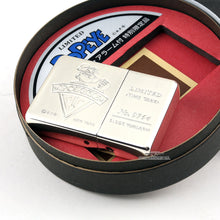 Load image into Gallery viewer, The closed Zippo Limited Edition Popeye Travel Clock. The engraved left side of the clock has Popeye holding a spinach can, and on the right reads "Limited Time Tank No. 0765 Clock W/Alarm. The clock sits on top of the circular presentation box.