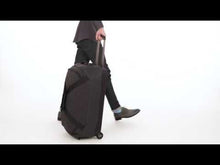 Load and play video in Gallery viewer, Review of the wheeled duffle featuring the telescopic handle, TSA lock, vast interior, and organization pockets.