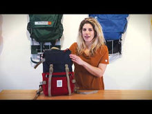 Load and play video in Gallery viewer, Review of the Rover Pack Classic  showing the exterior compartments, zippers, gear attachment points, expandable bottle pockets, reflective paracords, cinch closure, spacious interior, laptop compartment, and padded straps and back panel.