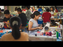 Load and play video in Gallery viewer, Behind the scenes short describing the production of Cotopaxi bags, including interviews of the employees and Vice President of Product Design.