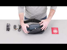 Load and play video in Gallery viewer, Review of the Aion sling bag featuring the spacious interior, organization zipper-closing pockets, and key sling, being filled with travel accessories.