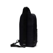 Load image into Gallery viewer, Angled back panel view of the black sling bag.
