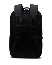 Load image into Gallery viewer, Back panel view of the black Kaslo backpack with the sternum strap attached.
