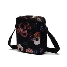 Load image into Gallery viewer, Angled back view of the black crossbody bag with flower pattern.
