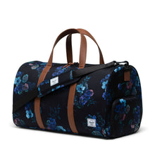 Load image into Gallery viewer, A black evening floral print duffle bag with brown leather handles, a zippered closure, and an adjustable shoulder strap.

