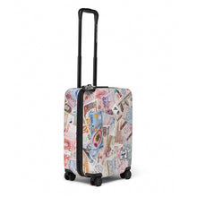 Load image into Gallery viewer, Angled side panel view of the hard shell suitcase with the telescopic handle extended. 
