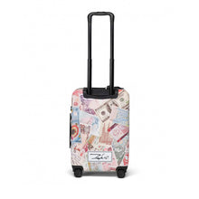 Load image into Gallery viewer, Back panel view of the suitcase with the telescopic handle extended.
