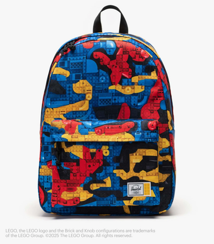 Front panel view of the backpack with blue, yellow, and red LEGO block patterns. Placed on a white background.