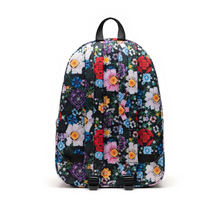 Load image into Gallery viewer, Back panel view of the backpack with colorful Lego Brick floral pattern.
