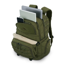 Load image into Gallery viewer, Angled front view of the moss backpack with a laptop, book, cellphone, and shirt peeking from four different compartments. 
