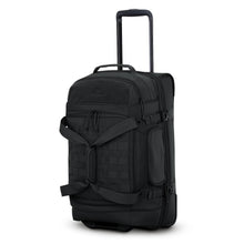 Load image into Gallery viewer, Angled front view of the black wheeled duffle bag with the telescopic handle extended. 
