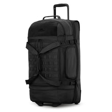 Load image into Gallery viewer, Angled front panel view of the large black duffle bag. 
