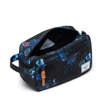 Load image into Gallery viewer, Angled view of the black travel kit with flower print.
