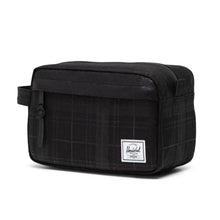 Load image into Gallery viewer, Angled front view of the Plaid Embossed black travel kit bag.
