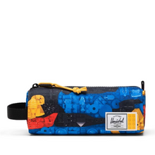 Load image into Gallery viewer, Colorful pencil case with abstract LEGO pieces print and a Herschel logo on a white background
