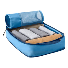 Load image into Gallery viewer, Angled view of the Blue Dawn compression cube with clothes rolled and organized inside.
