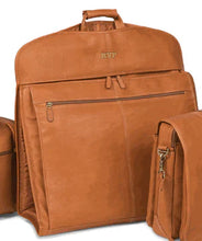 Load image into Gallery viewer, Angled front close up of the tan leather garment sleeve, arranged between a portfolio and a duffle bag.
