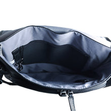 Load image into Gallery viewer, Interior view of the black leather messenger bag. A key clip and pockets are available. 
