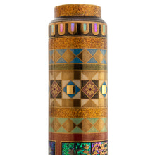 Load image into Gallery viewer, Close up to an end of the pen. A series of intricate, geometric patterns decorate it in different colors of gold blue, burgundy, white, and green lacquer, powdered gold. Each is forming shapes of squares, triangles and flower designs.
