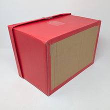 Load image into Gallery viewer, Angled bottom panel view of the red cardboard box for the wooden chest. 
