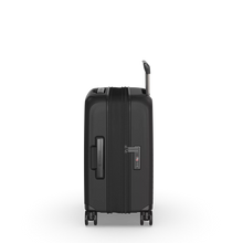Load image into Gallery viewer, Side view of the hard shell suitcase. The expandable feature is unzipped. 
