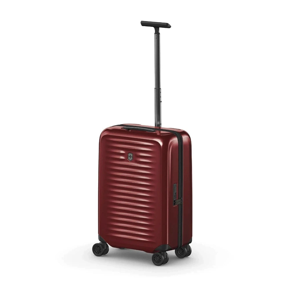 Angled front panel view of the red suitcase with the telescopic handle extended.
