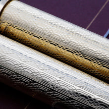 Load image into Gallery viewer, Close up to the engraved decorations on the barrels. 
