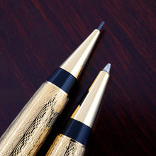 Load image into Gallery viewer, Close up to the nose sections of the pen and mechanical pencil. Placed on top of the wooden presentation box.

