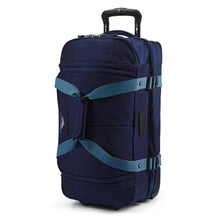 Load image into Gallery viewer, Front angle view of upright navy High Sierra wheeled duffel with extended handle.
