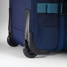 Load image into Gallery viewer, Close up of inline skate wheels on navy High Sierra wheeled duffel.
