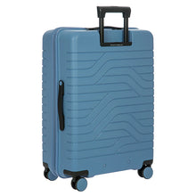 Load image into Gallery viewer, Back-angled view of the suitcase on a white background. 
