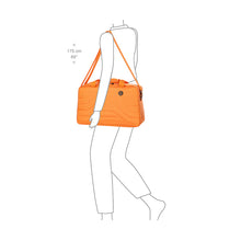 Load image into Gallery viewer, The suitcase shown being used by a drawn model on a white background.
