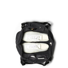 Load image into Gallery viewer, Top view of the bag with a set of shoes and accessories set within. 
