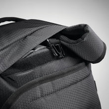 Load image into Gallery viewer, Close up of the black High Sierra duffel backpack strap attachment.
